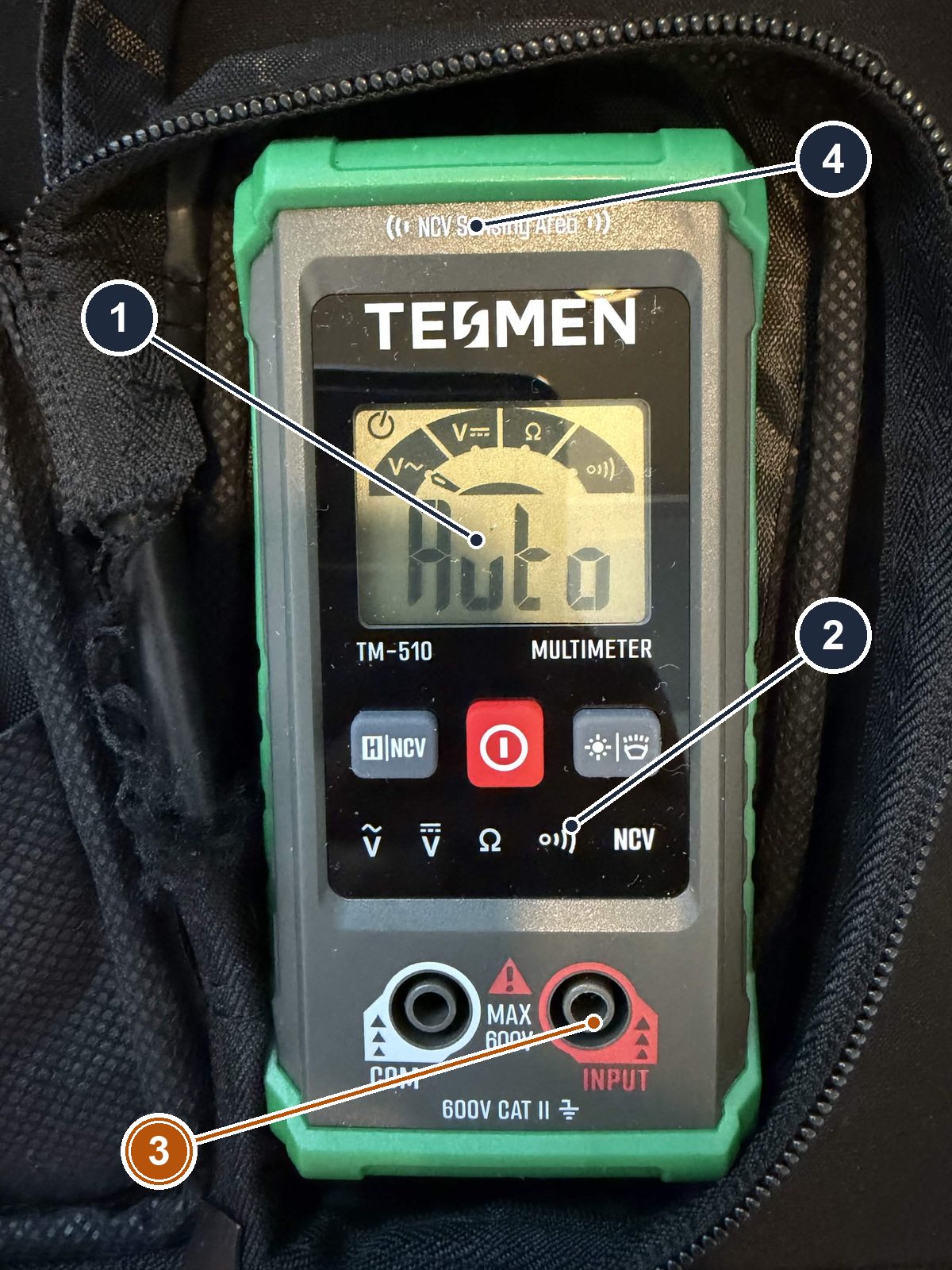 The bench multimeter, a TESMEN TM-510: display, mode buttons, COM and INPUT jacks