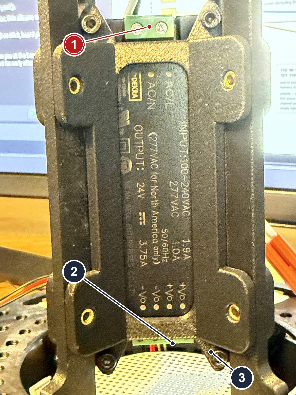 This build's IRM-90-24ST mounted on the fixture frame, mains block at the top, output block at the bottom