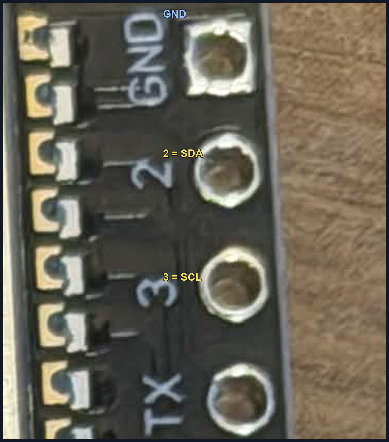 Close-up of the antenna-side header: GND, then 2 (SDA), then 3 (SCL), printed on the board itself