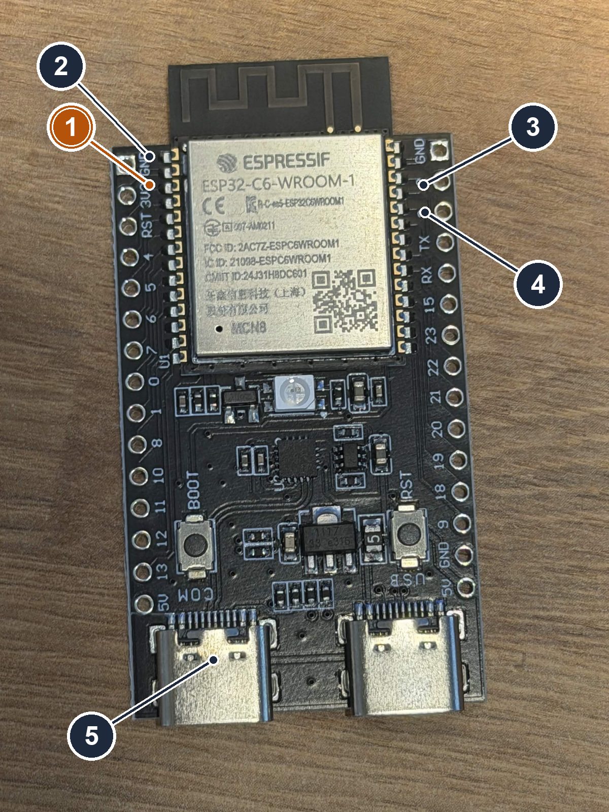 The spare ESP32-C6 dev board, bare, antenna up, two USB-C ports at the bottom