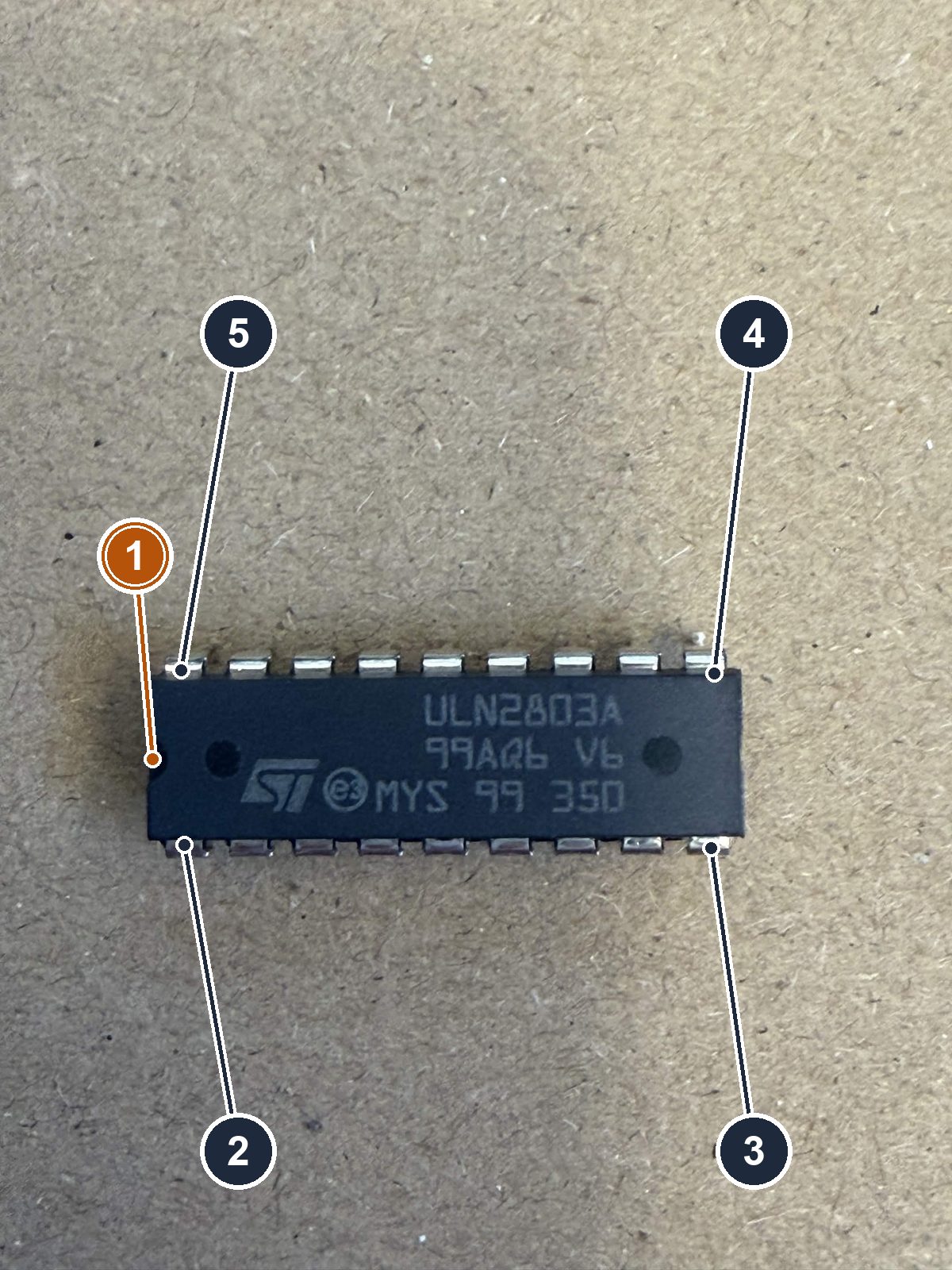 One ULN2803A chip: an 18-pin DIP with a half-moon notch at one end