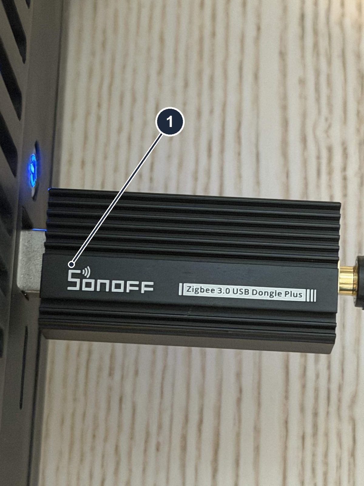 The Zigbee coordinator stick, plugged into the Home Assistant box